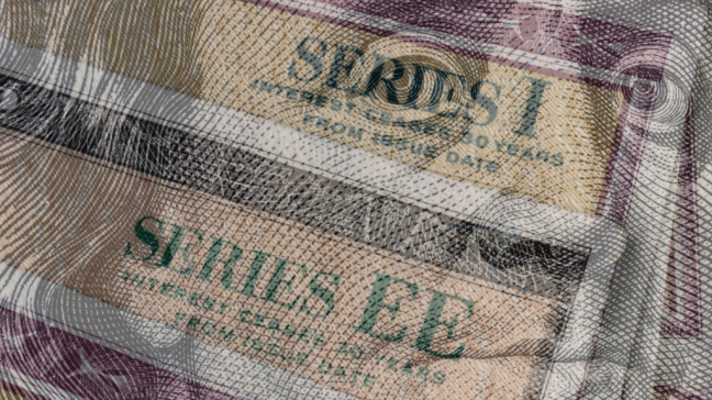 Series I and Series EE savings bonds with $100 bill overlay