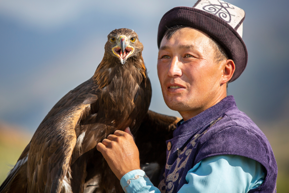 Traditional Kyrgyz hunter with his Golden Eagle