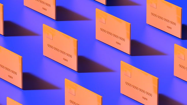Orange credit cards on a solid purple background