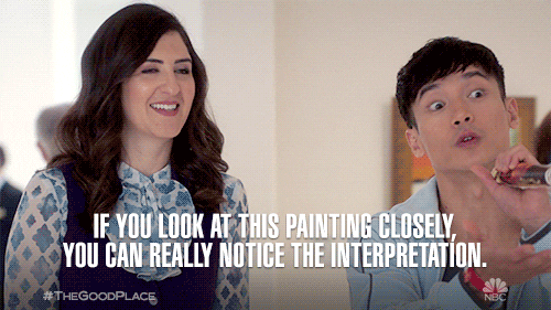 Gif of a man showing a woman a painting in an art gallery