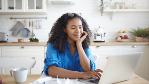 Paying rent with a credit card Smiling woman using her credit card to pay rent