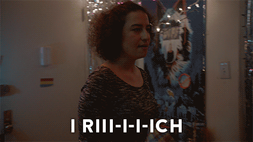 Gif of a woman saying 'I rich'