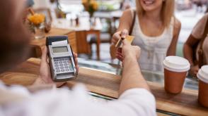 Woman making a purchase with her credit card at a store