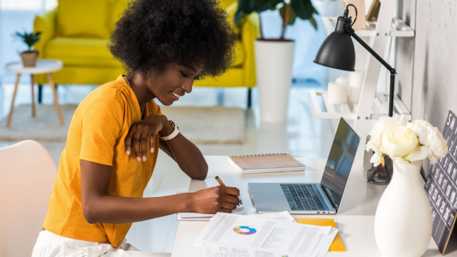 A woman conducting salary research from her home office