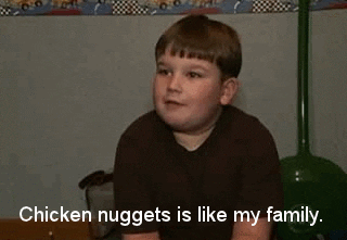 A gif of a young boy saying, "chicken nuggets is like my family"