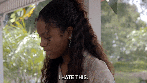 A gif of a young woman saying "I hate this."