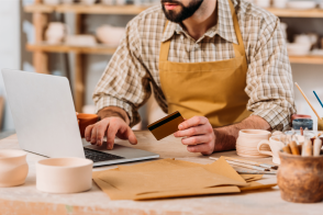 Business owner making credit card purchase online