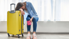 Image of an exhausted woman whose flight is delayed