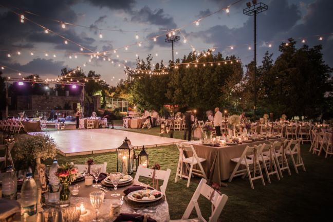 Wedding venue with dance floor and tables and chairs set up