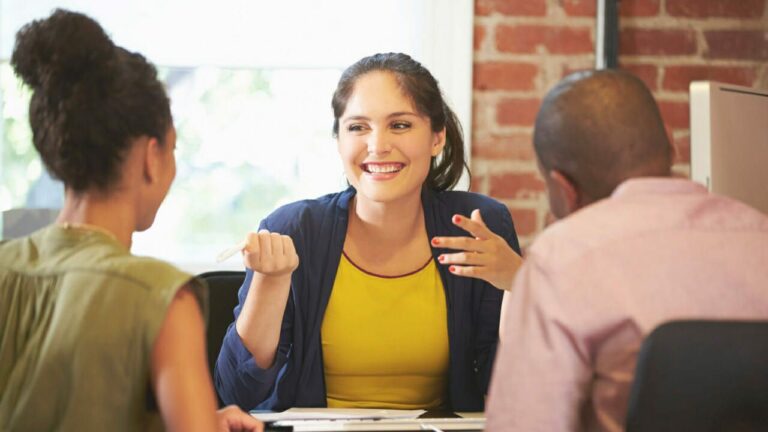 couple meeting with a financial advisor to plan financial future