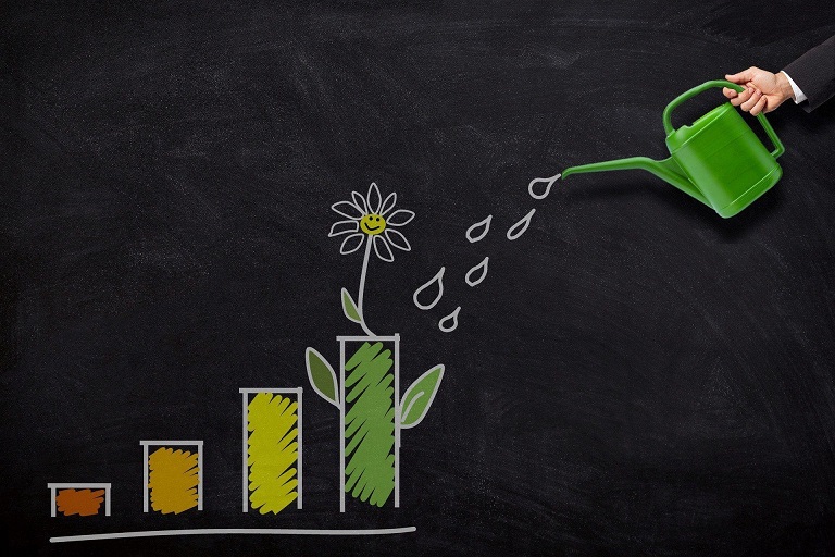 chart displaying increased dividends over time with the symbolism of a flower being watered to grow