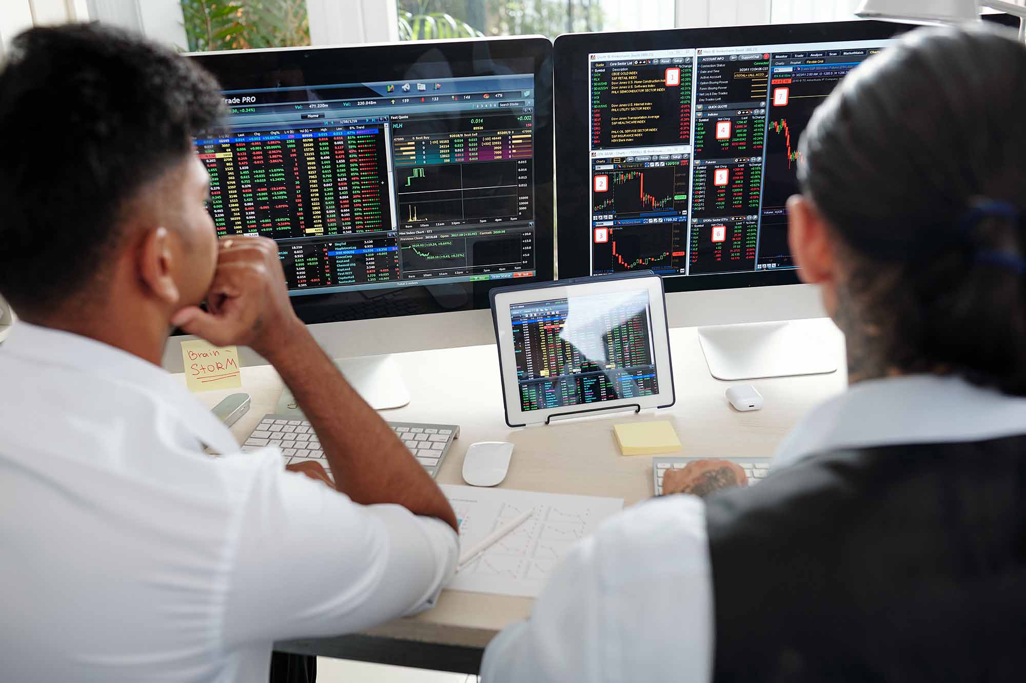 Traders looking at computer screens
