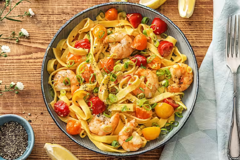 Photograph of creamy shrimp tagliatelle with heirloom tomatoes, garlic, and chili from HelloFresh.