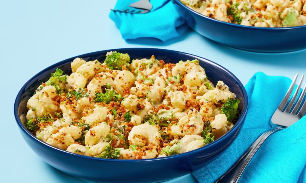 A photograph of preapred creamy cheddar cavatappi with broccoli from an EveryPlate meal kit.
