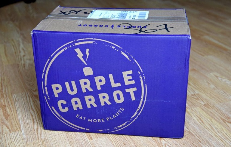 delivered brown shipping box with Purple Carrot logo