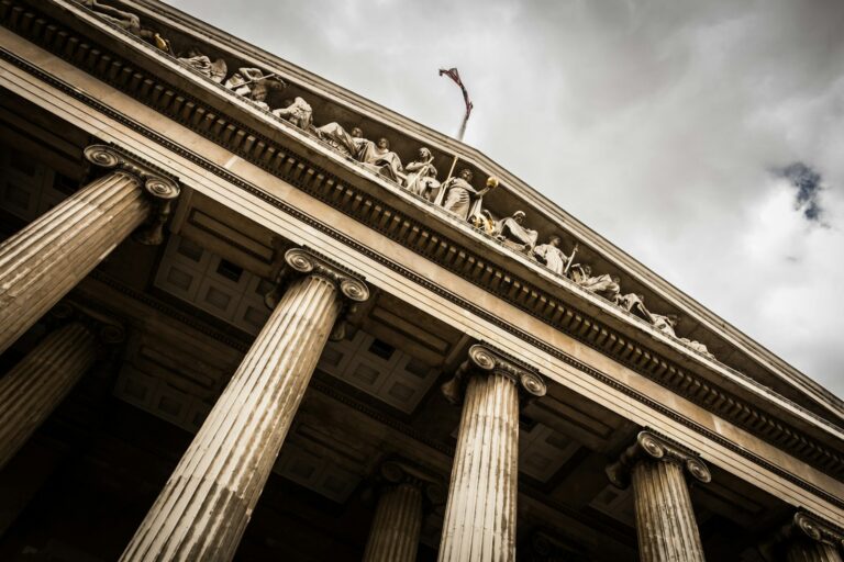 low angle photography of beige building; Best K-1 visa law firms