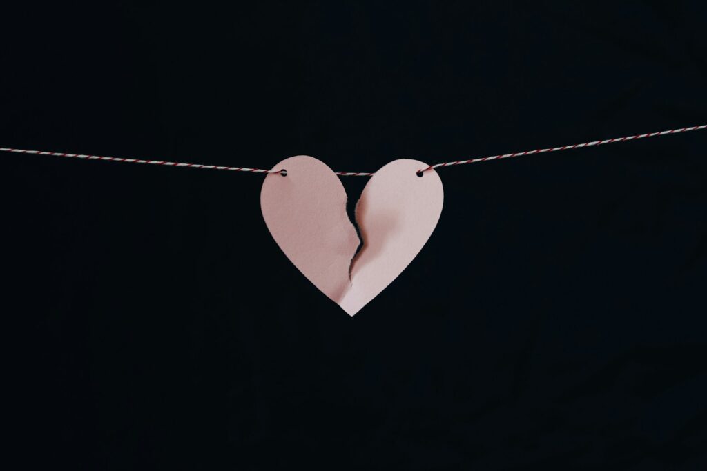 broken heart hanging on wire; divorce budget
