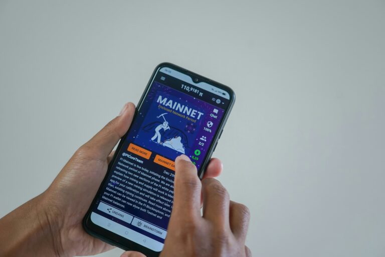Young professional checking an earned wage access app on a phone before payday