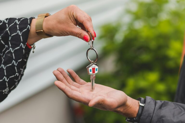 Property Management task of property manager handing house key to renter