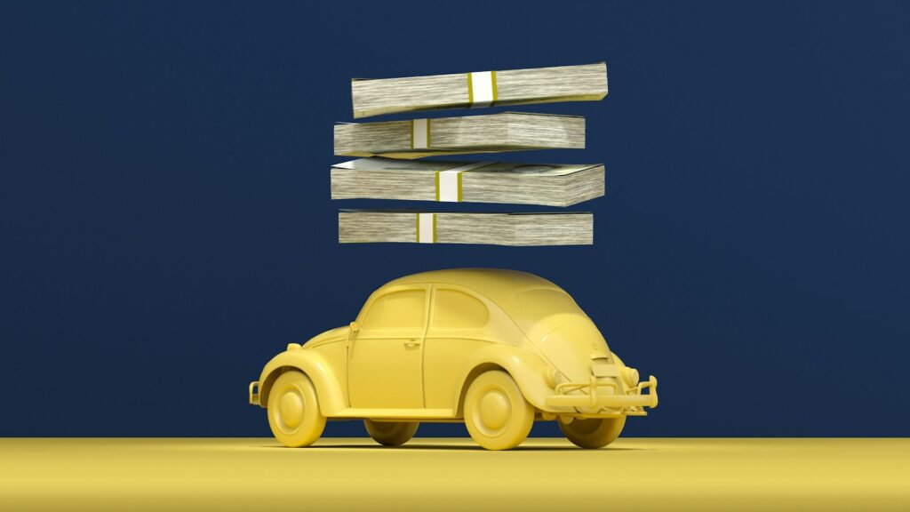 a yellow car with stacks of money on top of it; auto loan delinquencies